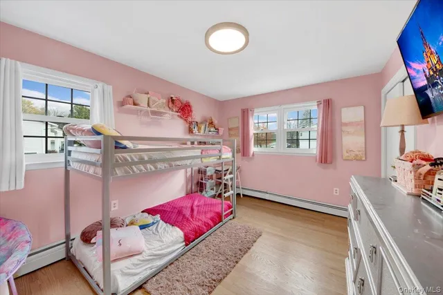 a bed room with a bed and a television