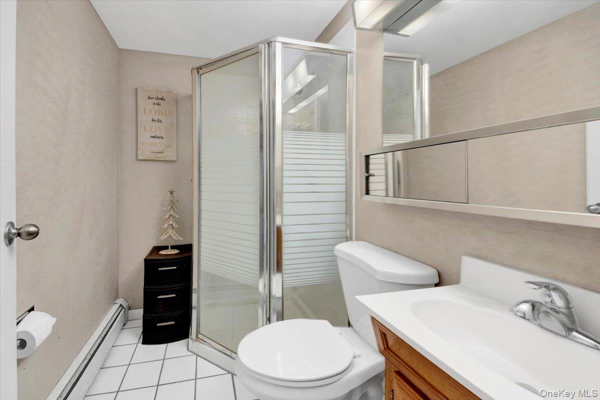 10 Scott Drive Middletown, NY 10941 - Photo 31 of 33 a bathroom with a toilet a sink and shower