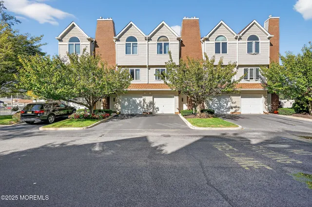a view of multiple houses with a street