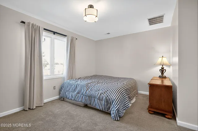 a room with a bed and a lamp