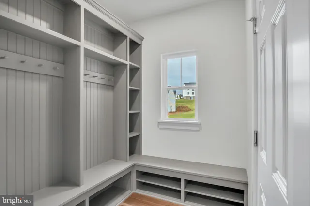 a bathroom with a window and toilet