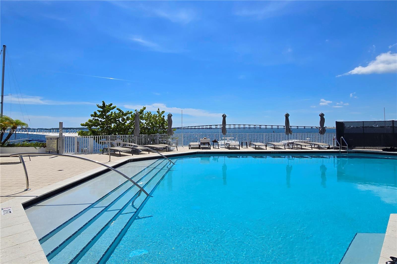 200 Southeast 15th Road, Unit 6F Miami, FL 33129 - Photo 12 of 38 a view of a swimming pool with seating area