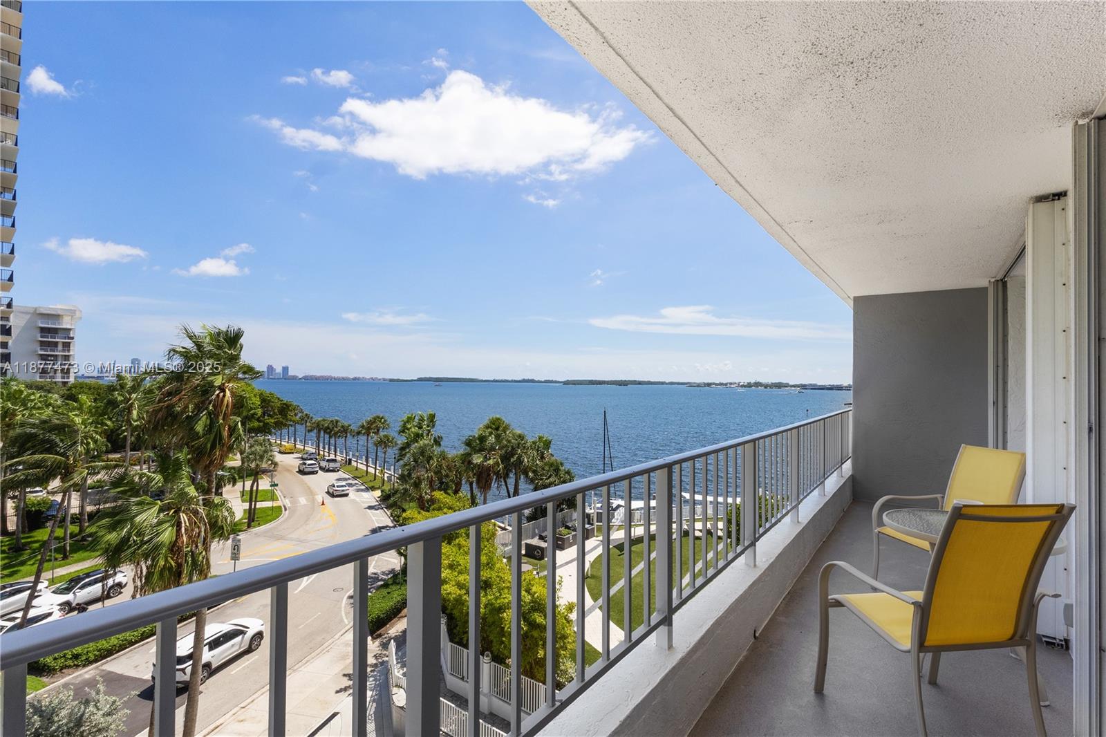 200 Southeast 15th Road, Unit 6F Miami, FL 33129 - Photo 16 of 38 a view of a balcony with chair and wooden floor