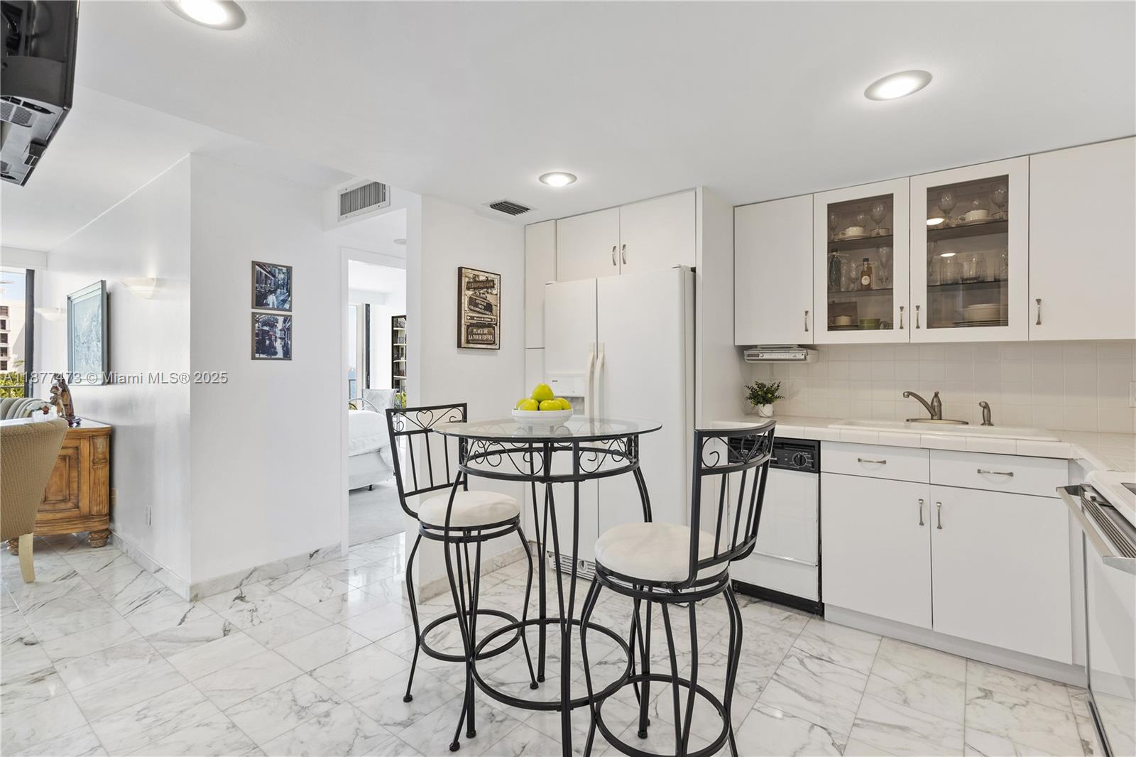 200 Southeast 15th Road, Unit 6F Miami, FL 33129 - Photo 19 of 38 a view of a kitchen area with furniture and wooden floor