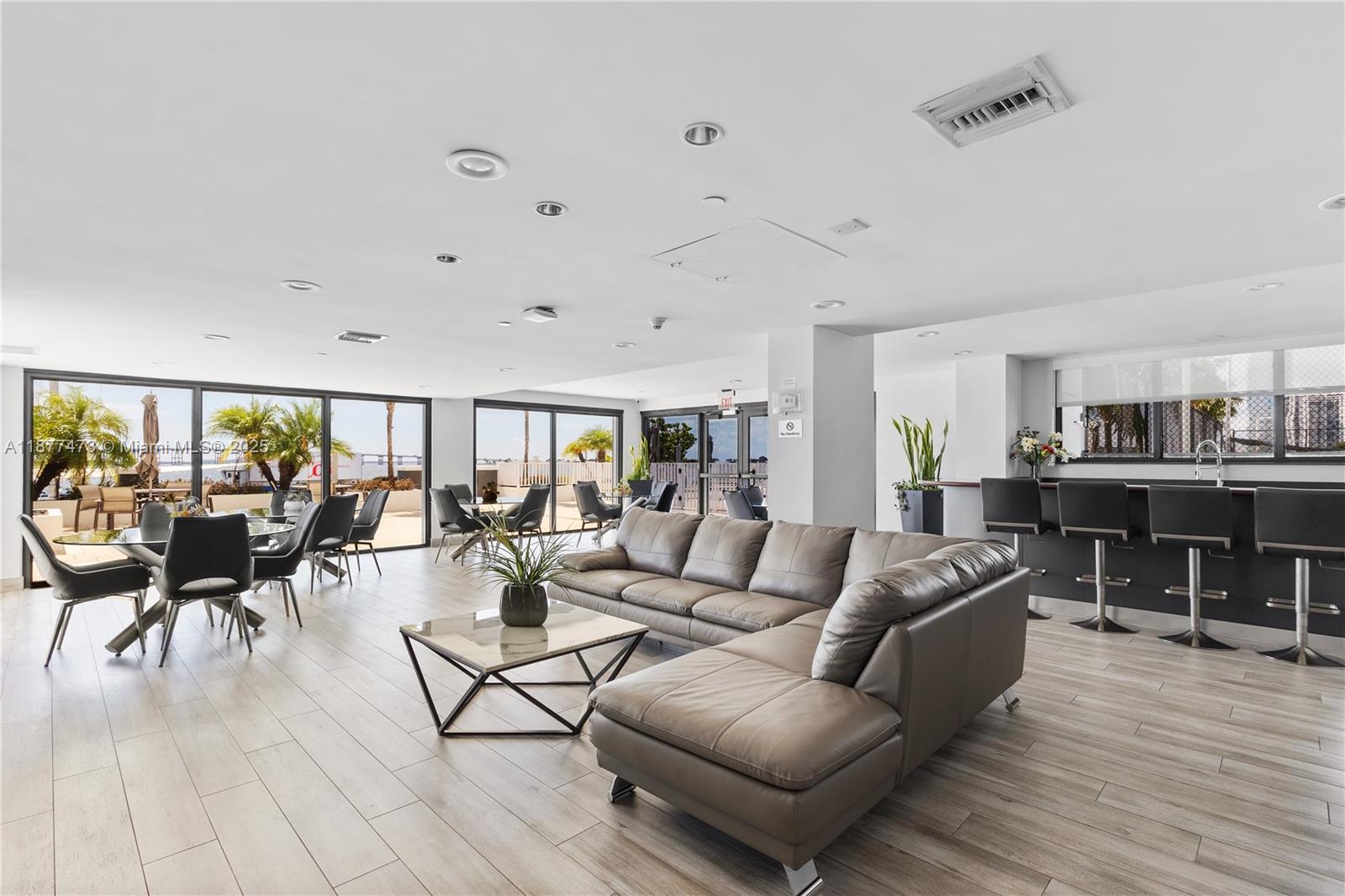 200 Southeast 15th Road, Unit 6F Miami, FL 33129 - Photo 36 of 38 a living room with furniture and a table