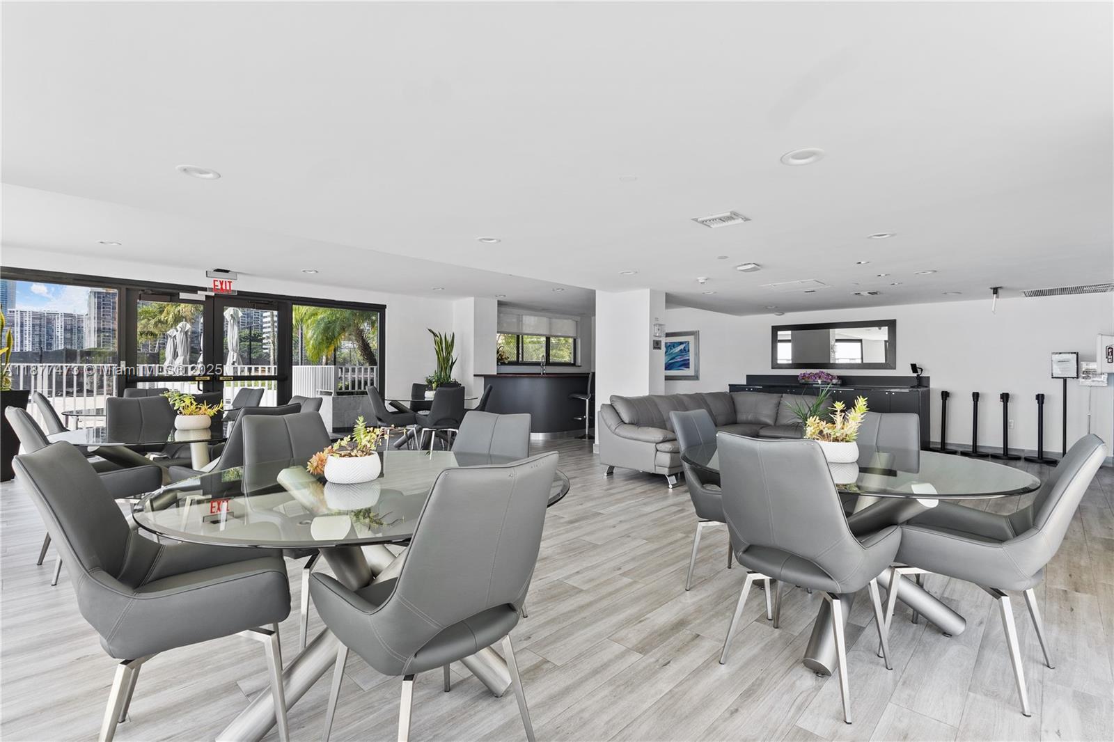 200 Southeast 15th Road, Unit 6F Miami, FL 33129 - Photo 37 of 38 a dining room with furniture and wooden floor