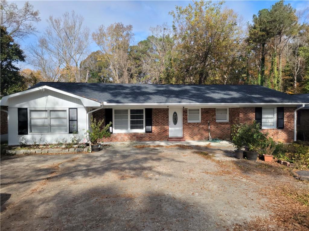 3664 Rockbridge Road Southwest Decatur, GA 30032 - Photo 1 of 1 a front view of a house with garden