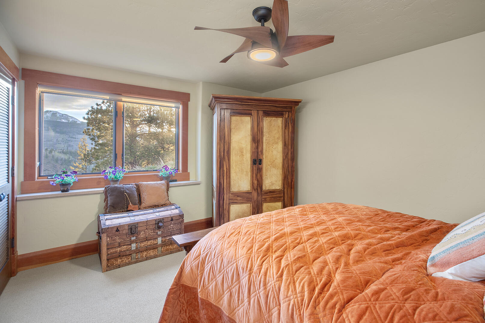 727 West Anderson Road Placerville, CO 81430 - Photo 13 of 31 a bed sitting in a bedroom next to a window