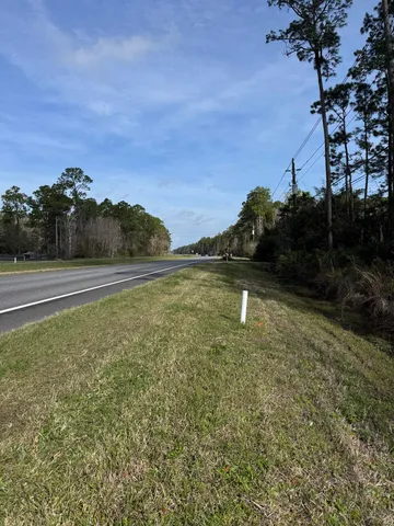a backyard of a house with lots of green space