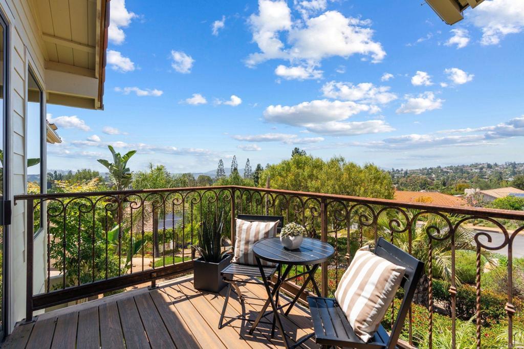 13319 Pacer Lane Poway, CA 92064 - Photo 18 of 75 a view of a balcony with chairs and wooden floor