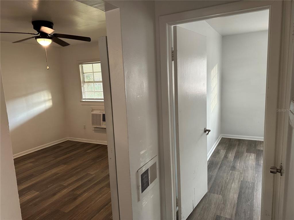 1109 Willow Avenue Sanford, FL 32771 - Photo 5 of 9 a view of an empty room with wooden floor and a window