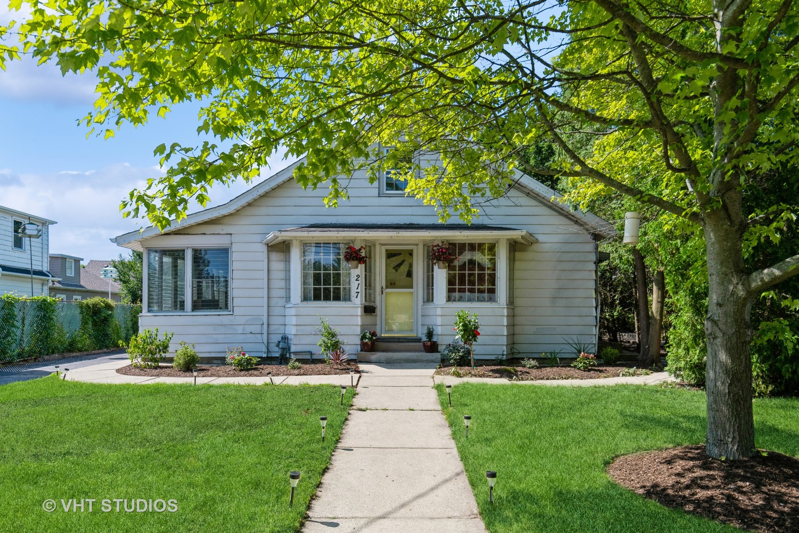 217 Prairie Avenue Highwood, IL 60040 - Photo 1 of 19 a front view of a house with a yard