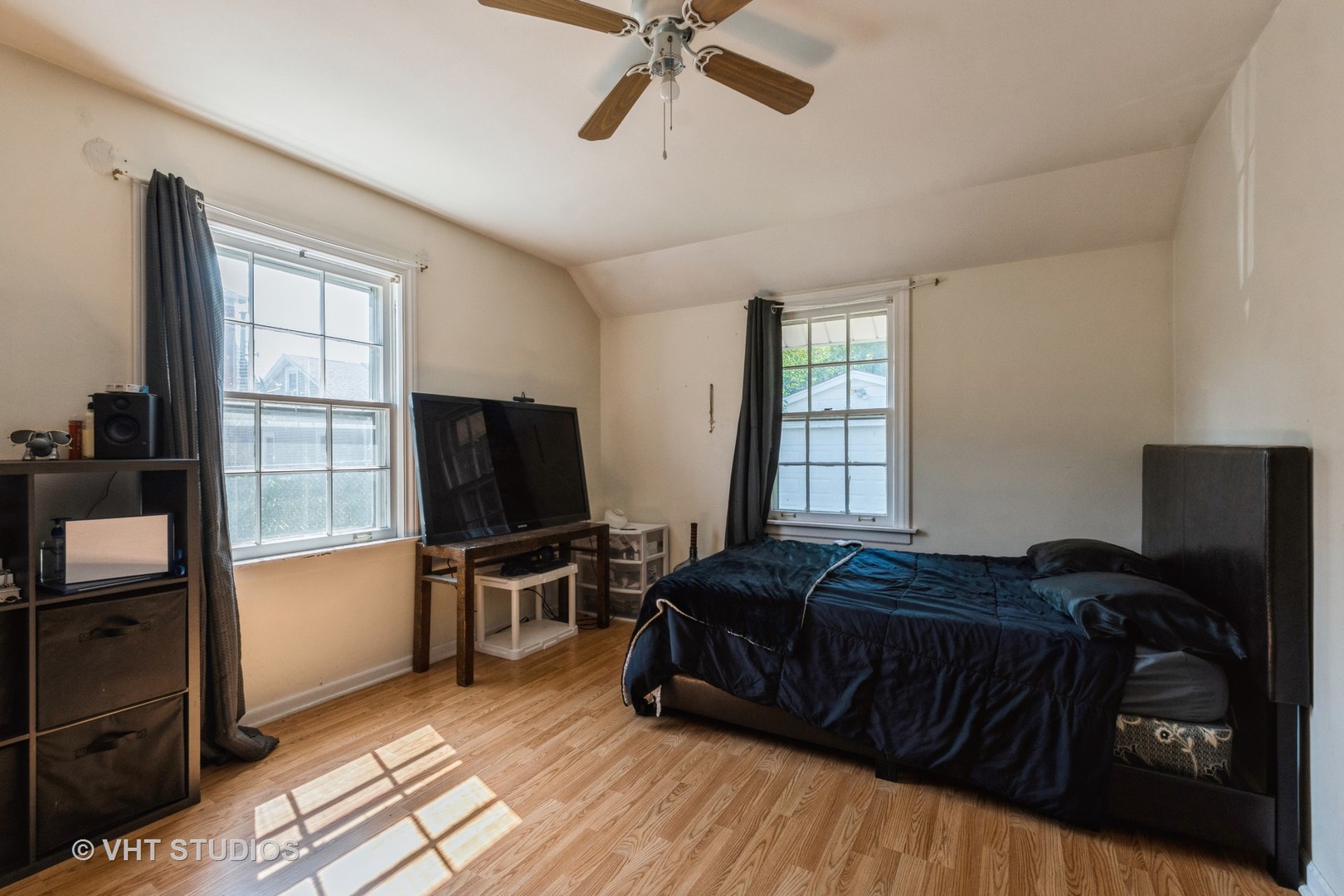 217 Prairie Avenue Highwood, IL 60040 - Photo 11 of 19 a bedroom with a bed and a flat tv screen
