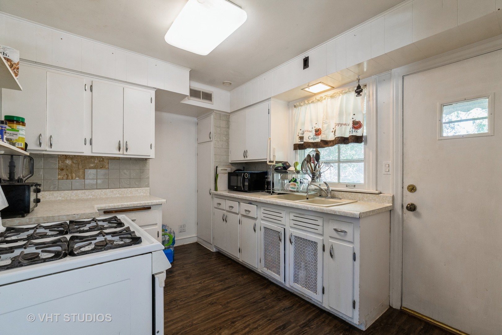 217 Prairie Avenue Highwood, IL 60040 - Photo 6 of 19 a kitchen with stainless steel appliances a sink stove and cabinets