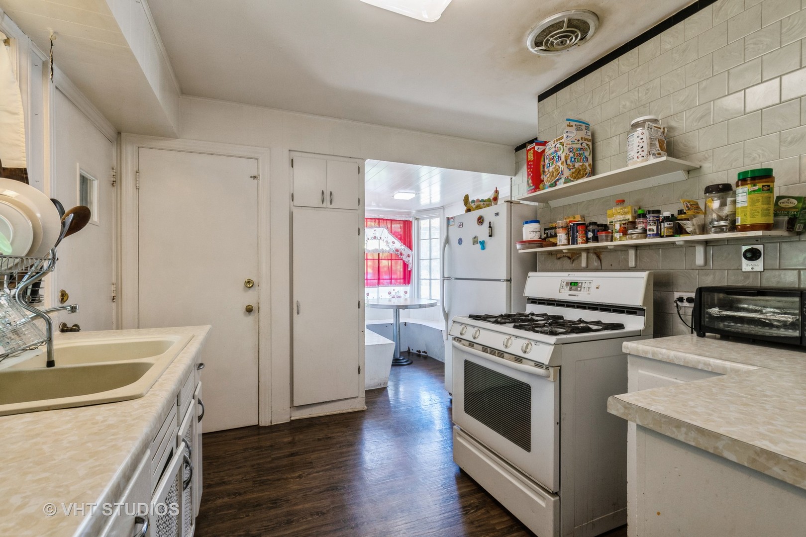 217 Prairie Avenue Highwood, IL 60040 - Photo 7 of 19 a kitchen with a stove and wooden floor