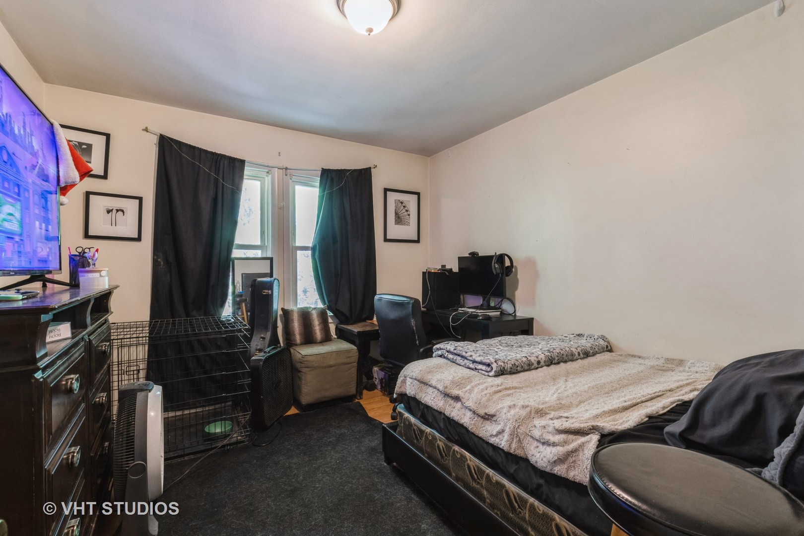 217 Prairie Avenue Highwood, IL 60040 - Photo 8 of 19 a bedroom with a bed and a television