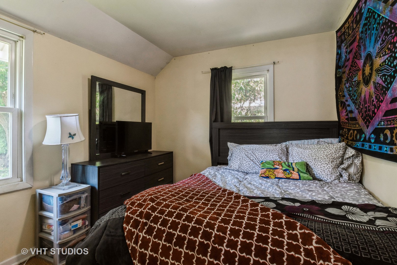 217 Prairie Avenue Highwood, IL 60040 - Photo 9 of 19 a bedroom with a bed and flat screen tv