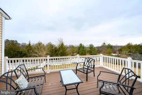 a view of a chairs and table on the roof