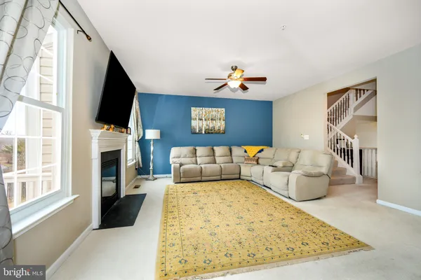 a bed room with a bed furniture and a flat screen tv