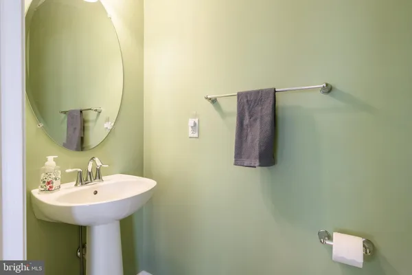a bathroom with a sink and mirror