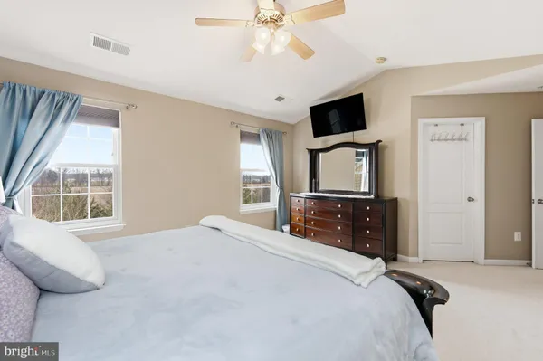 a spacious bathroom with a double vanity sink mirror and double
