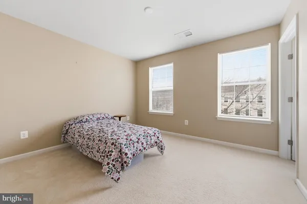a room with a couch and chandelier