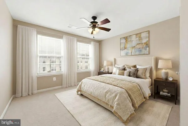 an empty room with chandelier fan