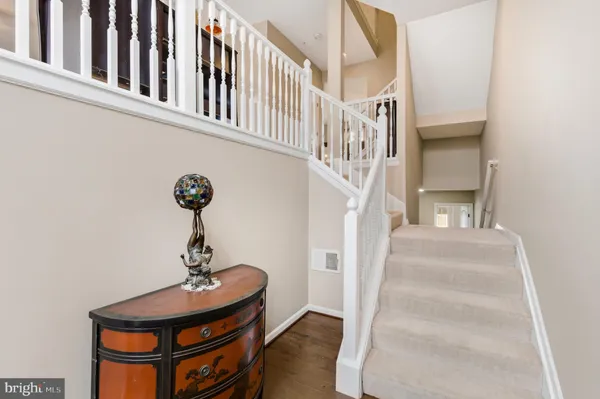 a view of entryway and hall with a front door