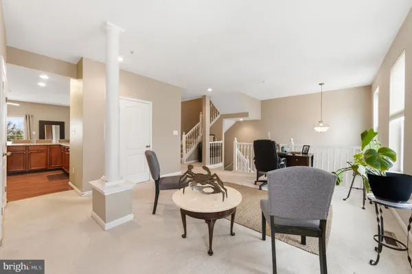 a view of a livingroom with furniture and a table
