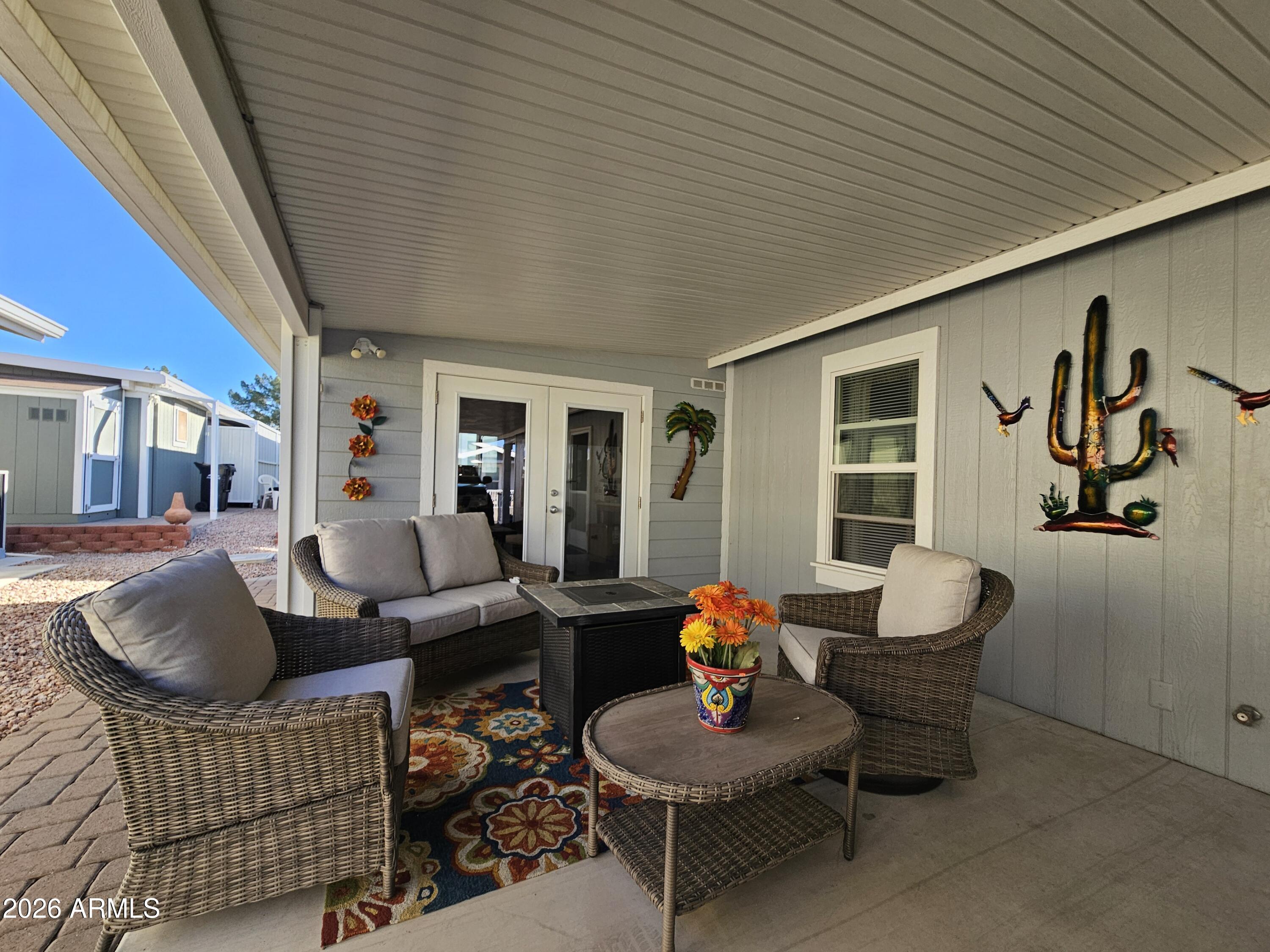 650 North Hawes Road, Unit 4010 Mesa, AZ 85207 - Photo 11 of 35 a living room with furniture and a wooden floor