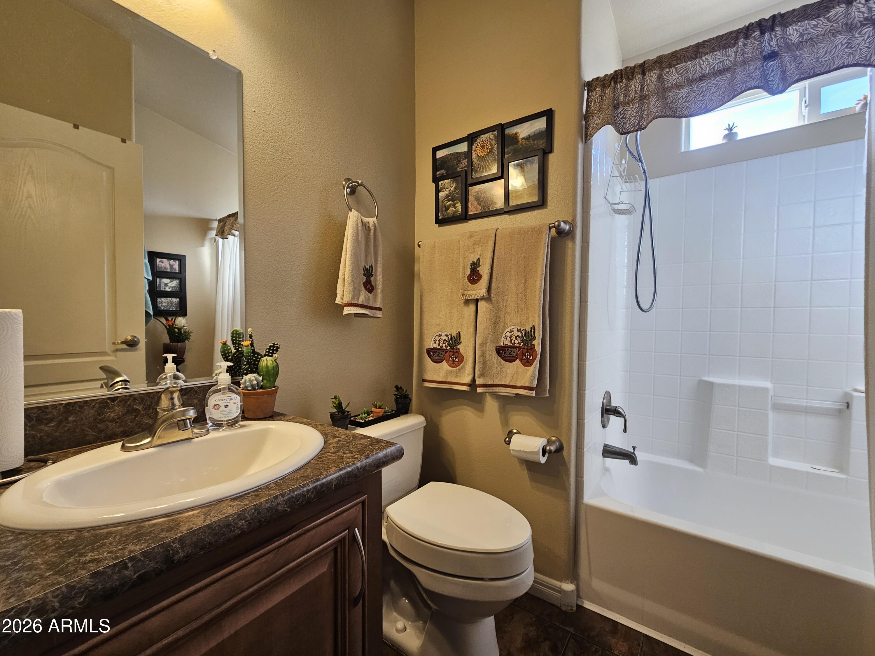 650 North Hawes Road, Unit 4010 Mesa, AZ 85207 - Photo 20 of 35 a bathroom with a sink toilet and shower