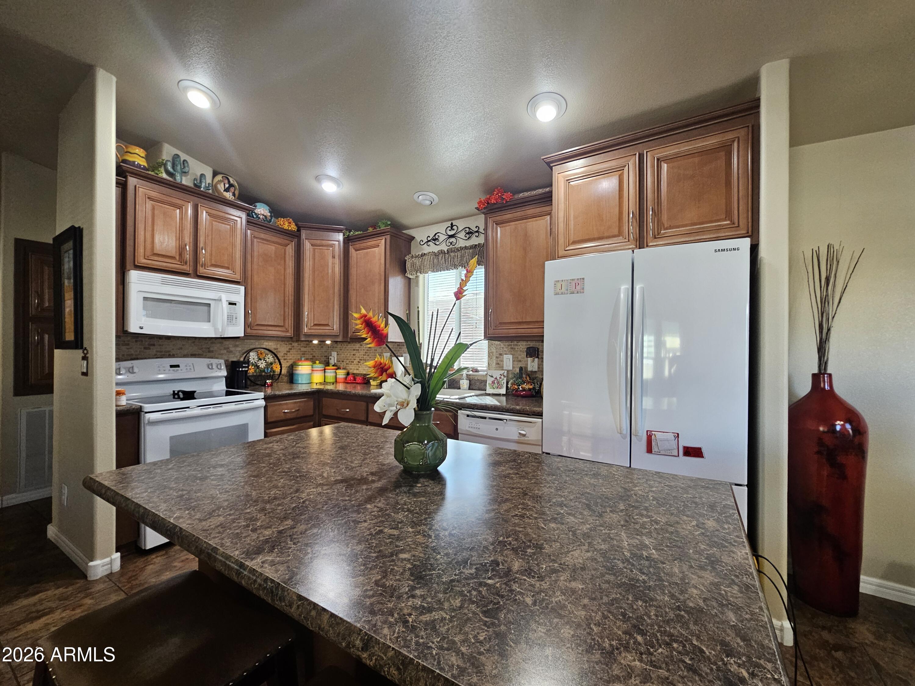 650 North Hawes Road, Unit 4010 Mesa, AZ 85207 - Photo 4 of 35 a view of a living room and kitchen