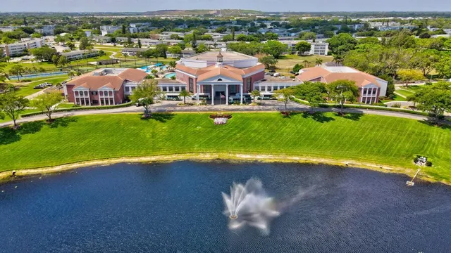 an aerial view of a house with a swimming pool