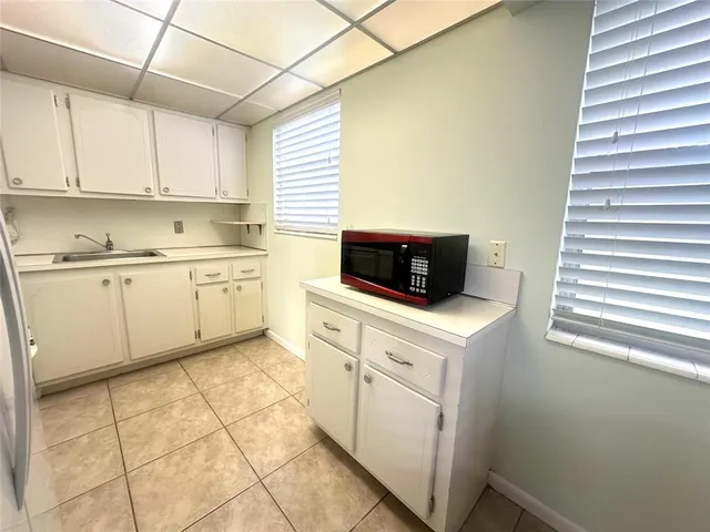 a dining room with a table and chairs