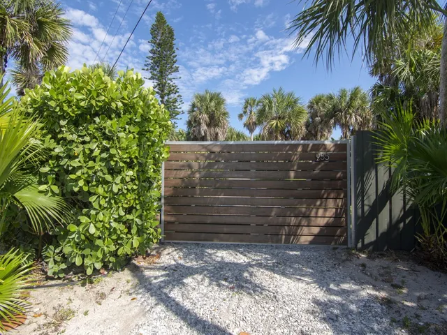 a big yard with lots of green space and palm trees
