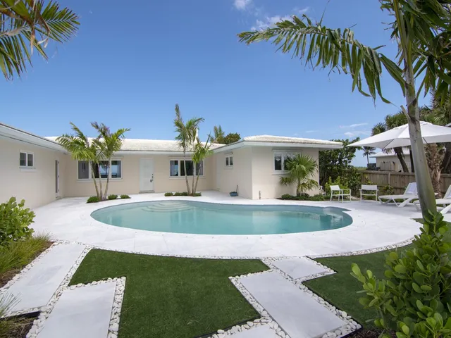 a view of a house with swimming pool
