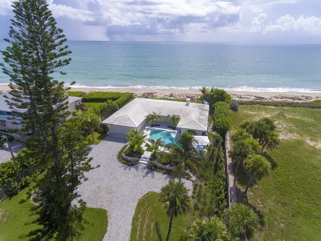 a balcony with table and chairs