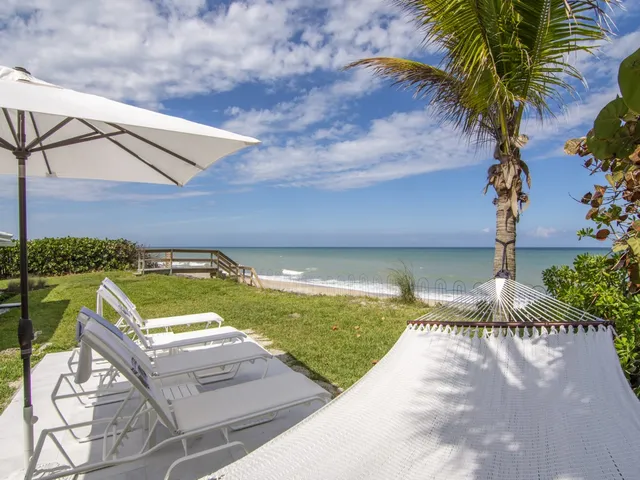 a view of swimming pool with a lounge chair