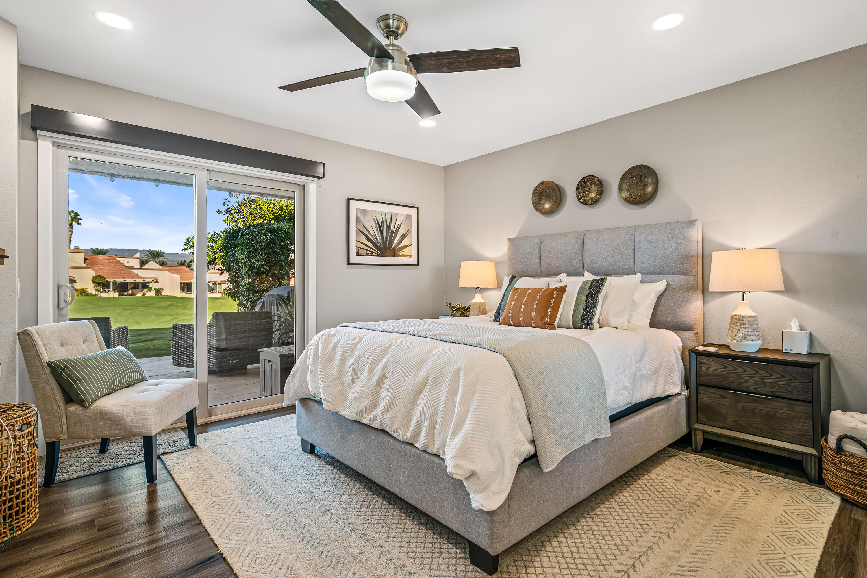 76632 Morocco Road Palm Desert, CA 92211 - Photo 13 of 38 a bedroom with a bed a chair and a large window