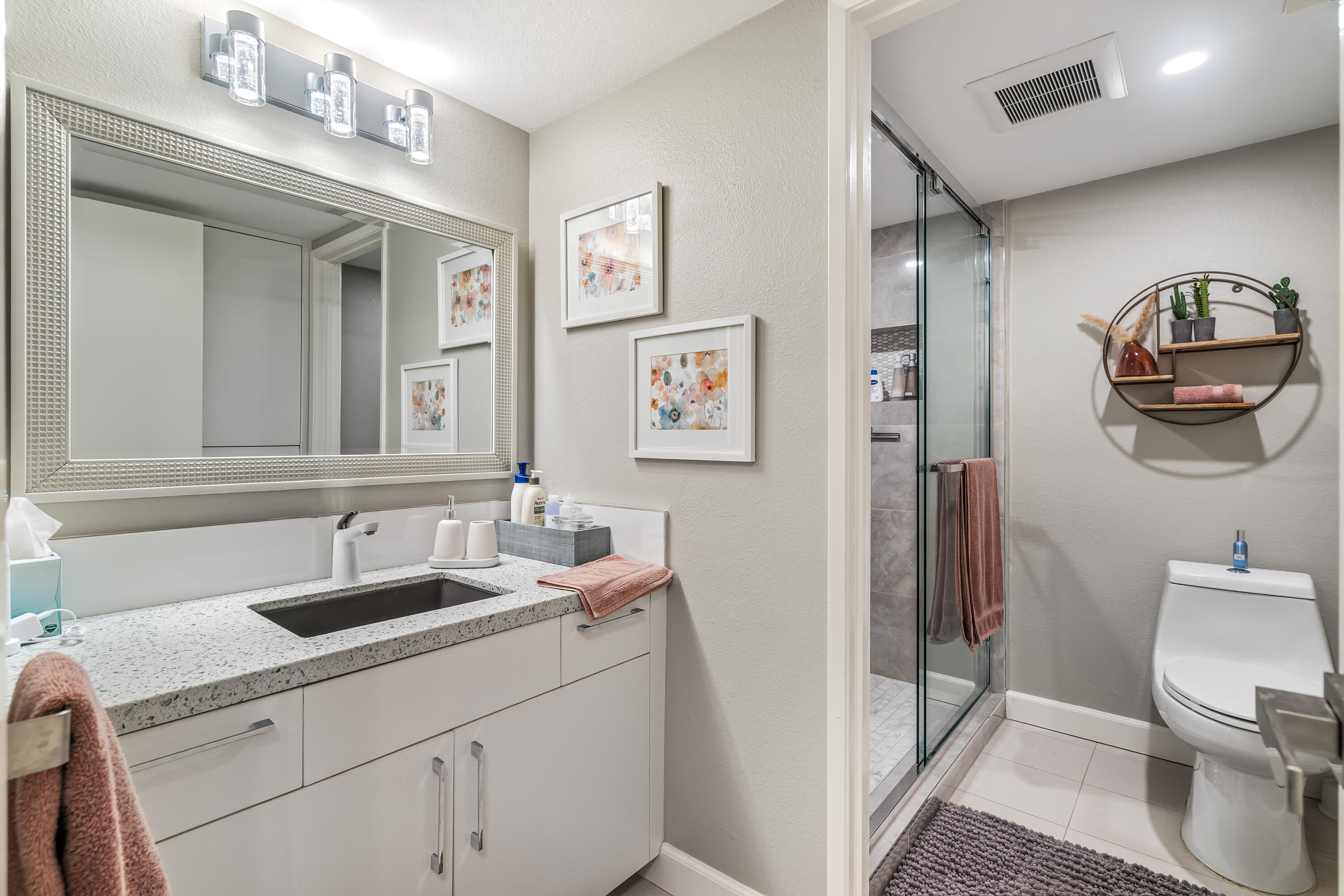 76632 Morocco Road Palm Desert, CA 92211 - Photo 17 of 38 a bathroom with a toilet sink and mirror