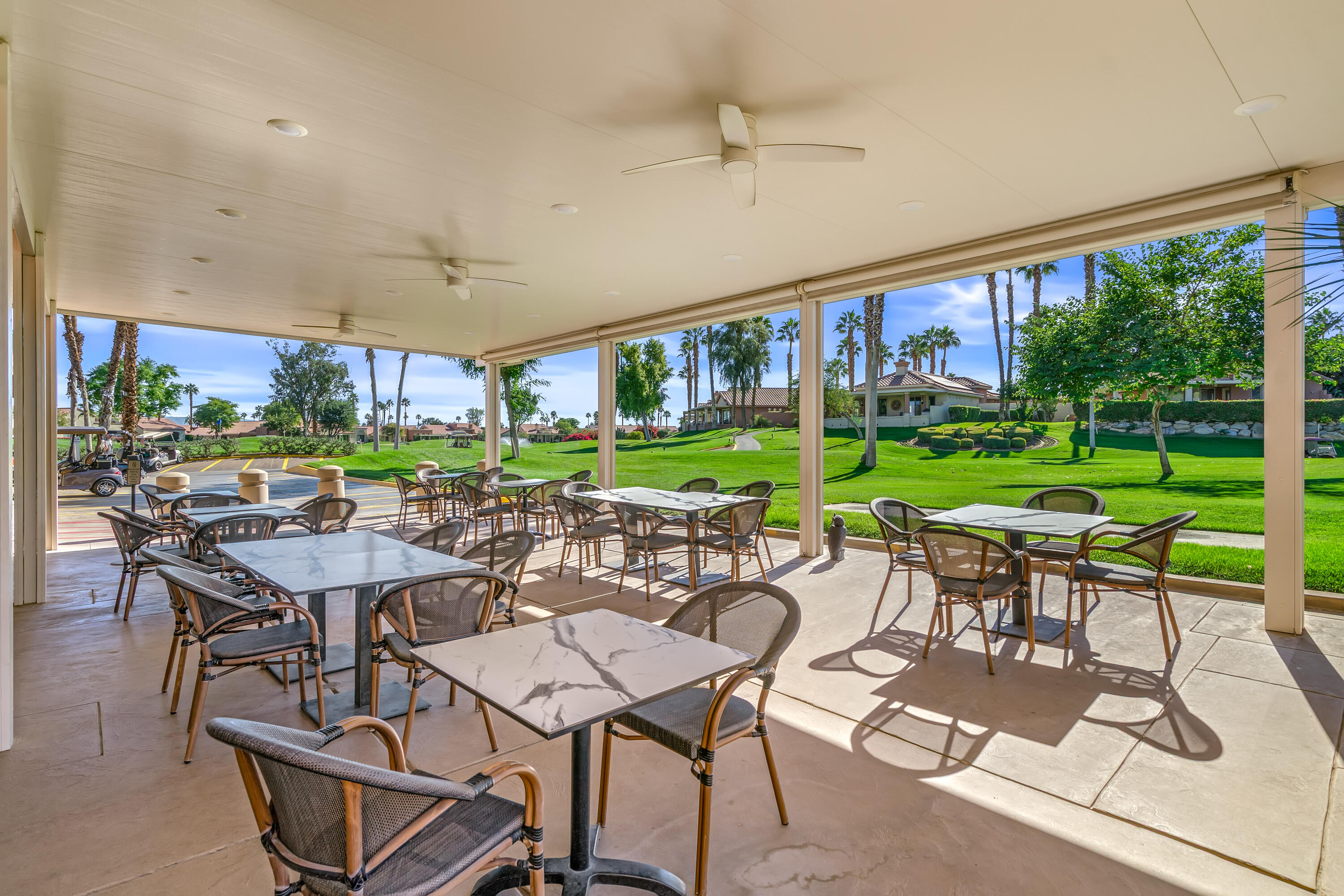 76632 Morocco Road Palm Desert, CA 92211 - Photo 35 of 38 a view of a patio with a dining table and chairs