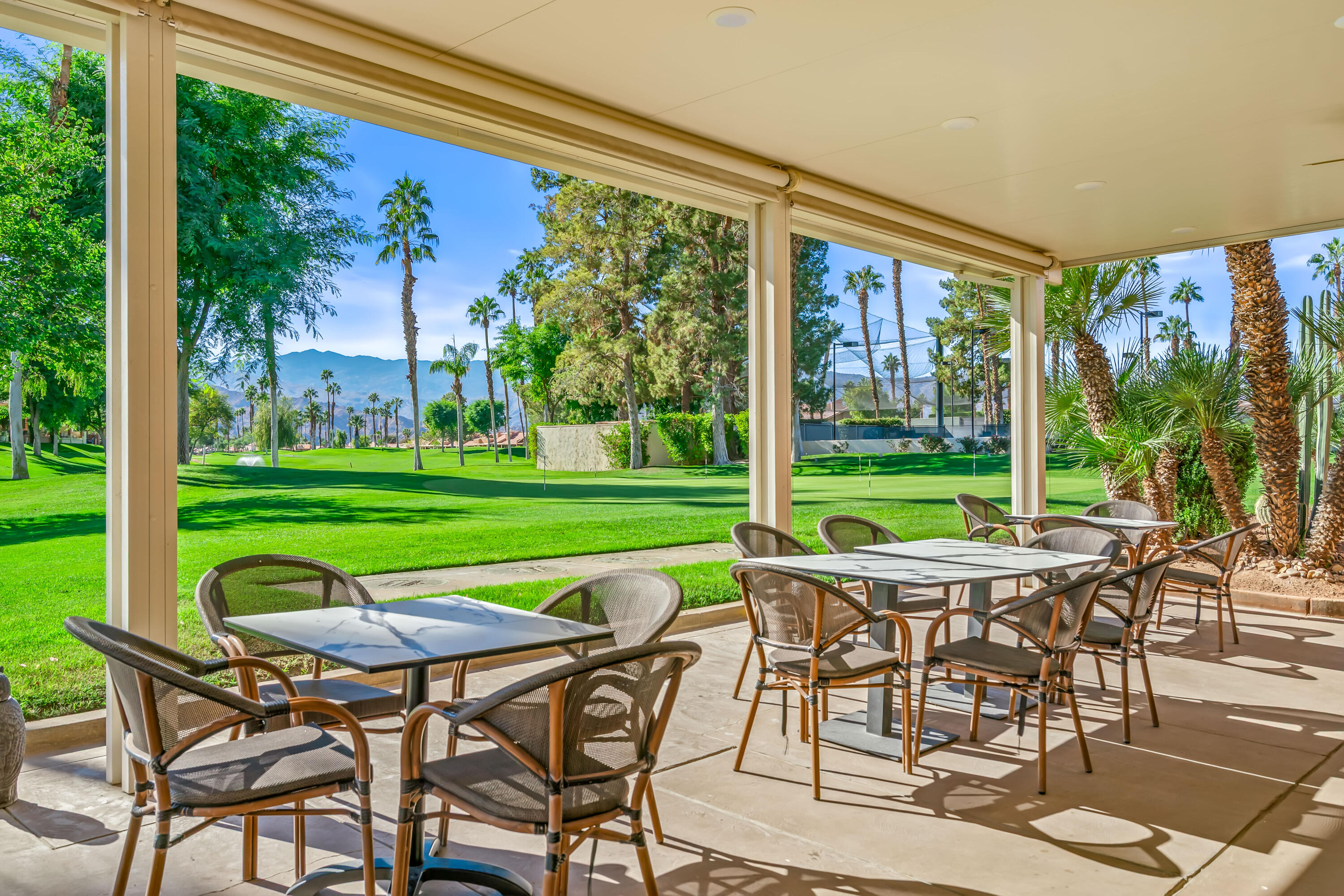 76632 Morocco Road Palm Desert, CA 92211 - Photo 36 of 38 a view of a chairs and table in patio with a yard