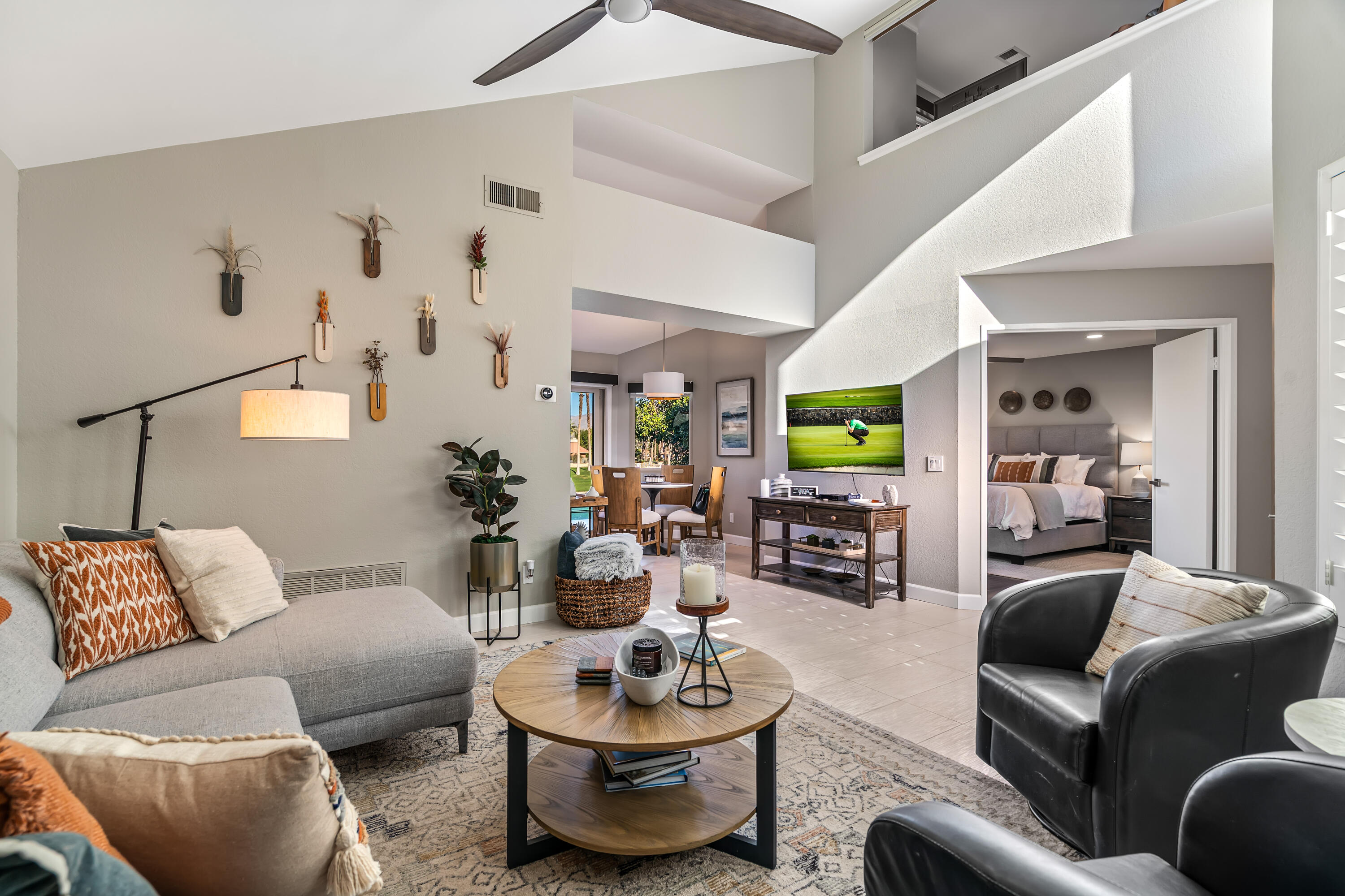 76632 Morocco Road Palm Desert, CA 92211 - Photo 5 of 38 a living room with furniture and a lamp