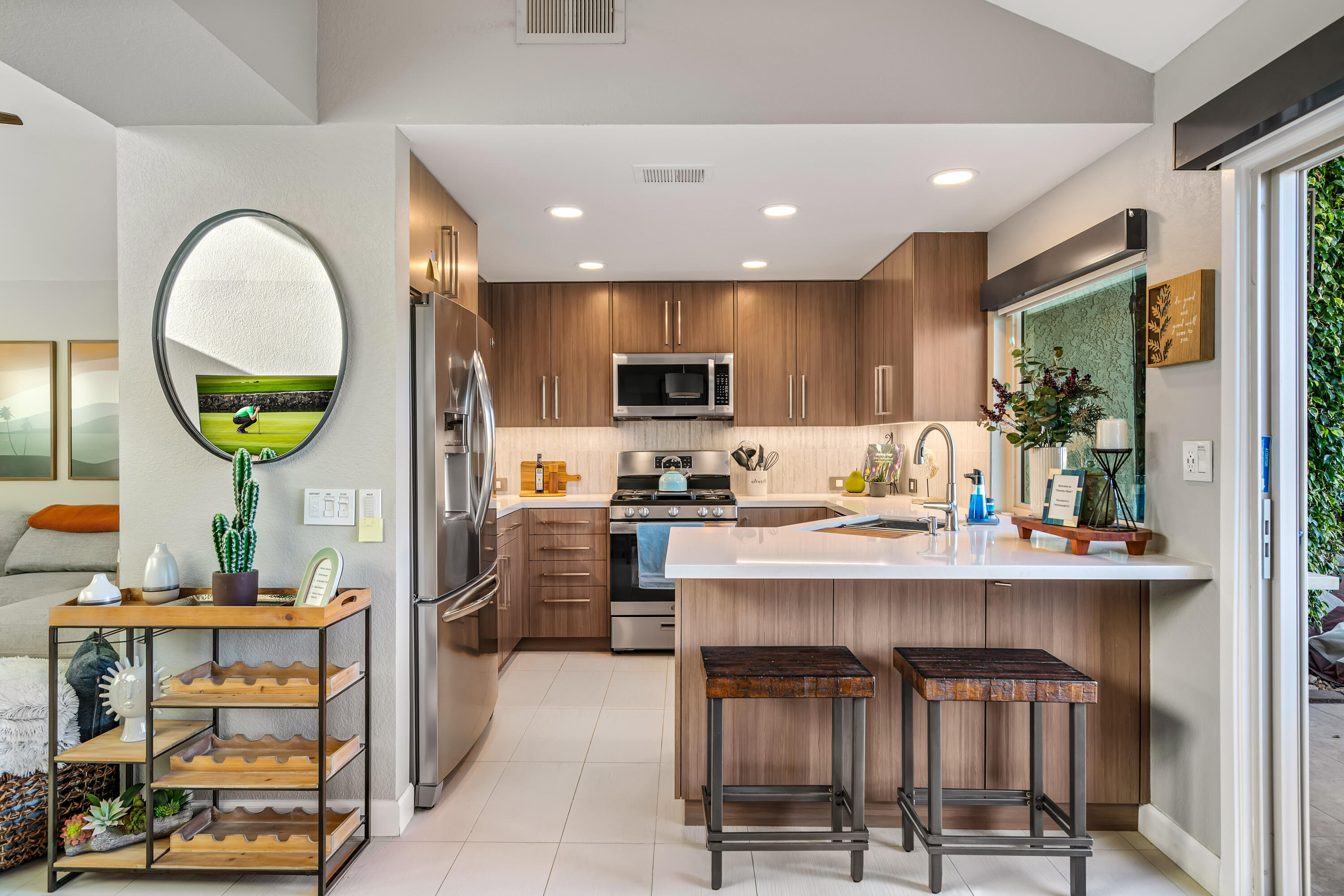 76632 Morocco Road Palm Desert, CA 92211 - Photo 8 of 38 a view of kitchen with stainless steel appliances granite countertop dining table chairs sink and stove