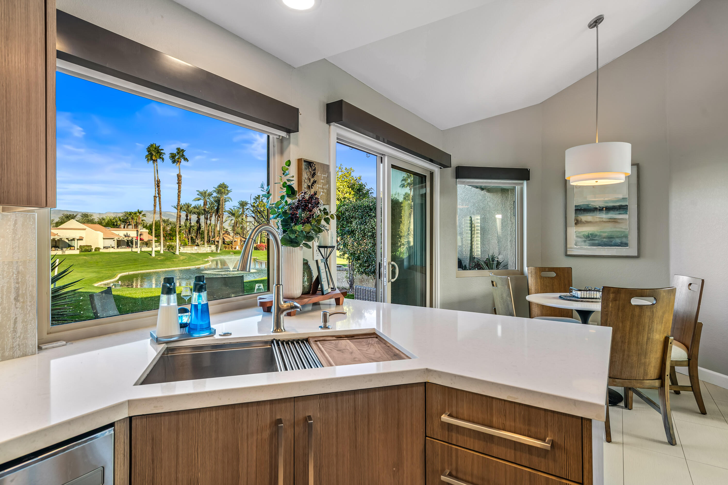 76632 Morocco Road Palm Desert, CA 92211 - Photo 9 of 38 a kitchen with a sink and a large window