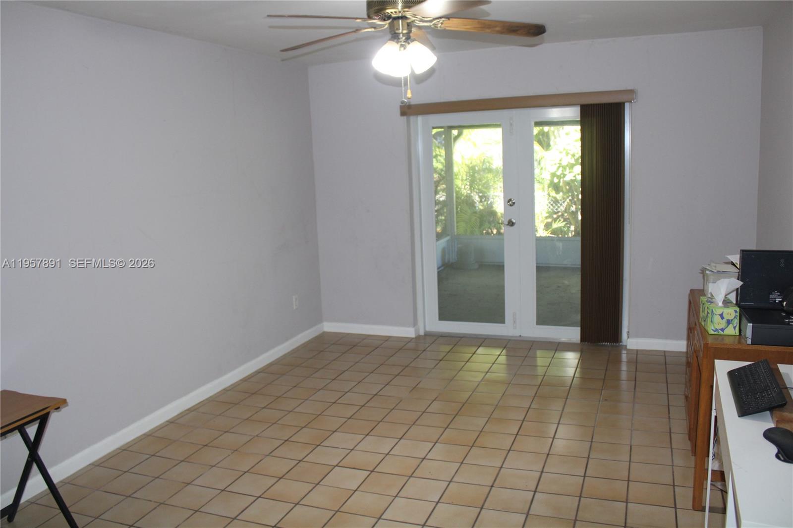 12965 Southwest 76th Terrace Miami, FL 33183 - Photo 11 of 29 a view of an empty room with a window