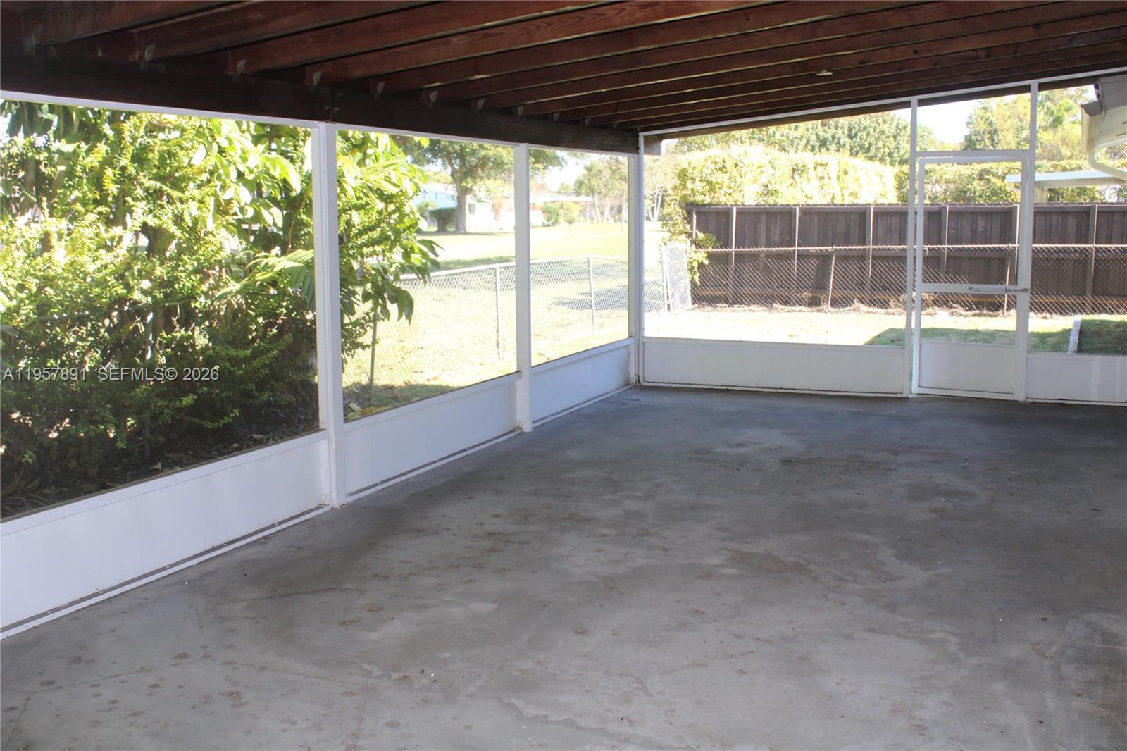 12965 Southwest 76th Terrace Miami, FL 33183 - Photo 16 of 29 a view of a room with window and an outdoor space