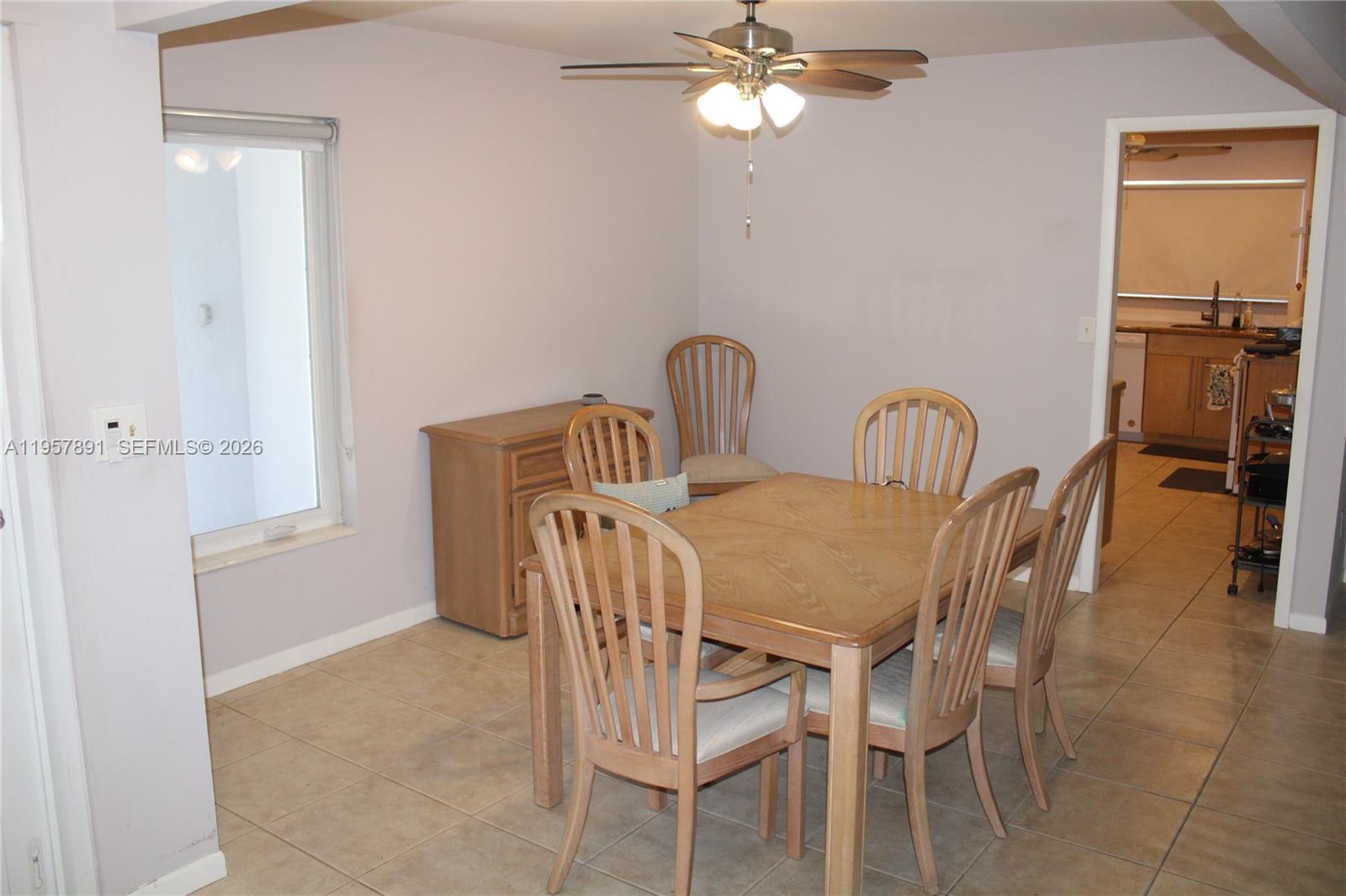 12965 Southwest 76th Terrace Miami, FL 33183 - Photo 18 of 29 a view of a dining room that has a table and chairs