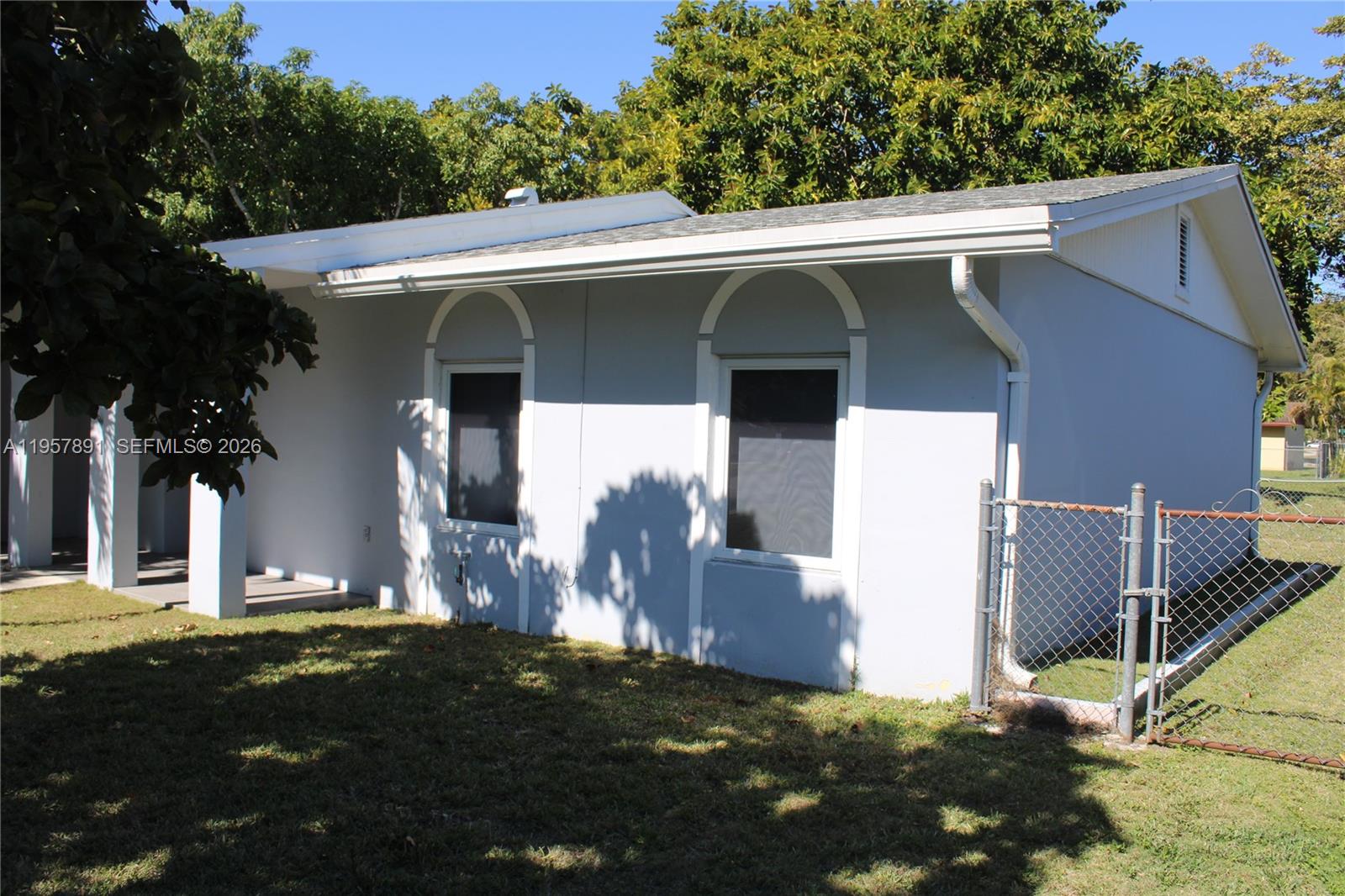 12965 Southwest 76th Terrace Miami, FL 33183 - Photo 2 of 29 a view of a house with a yard