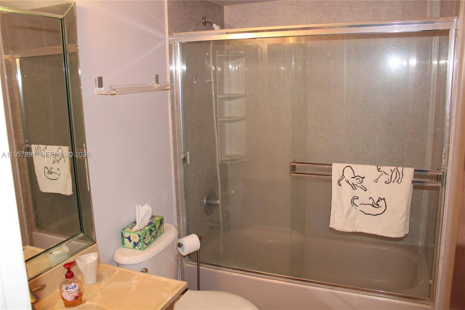 12965 Southwest 76th Terrace Miami, FL 33183 - Photo 22 of 29 a bathroom with a shower curtain and a sink